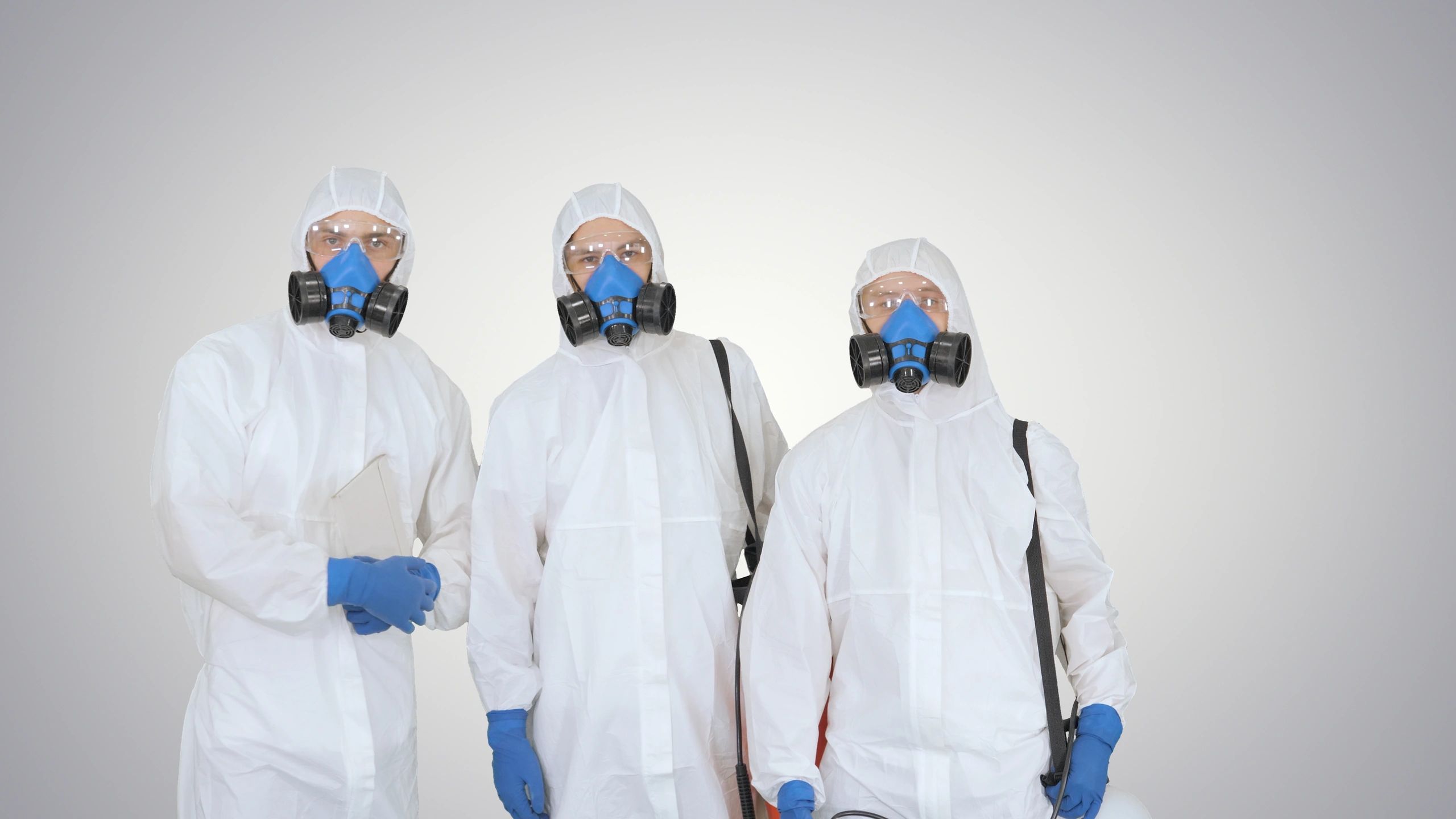Professional cleaning team standing together with equipment